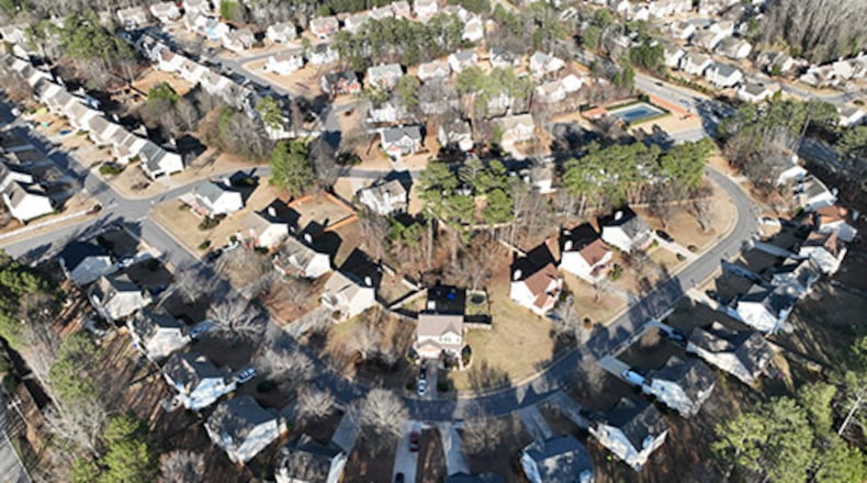 Aerial view of Winslow at Eagles Landing neighborhood, where large number of homes are owned by investors, Thursday, Jan. 26, 2023, in McDonough. Two companies — Invitation Homes and Progress Residential — each own more than 10,000 homes in the metro Atlanta area as of, or near the end of, the 2nd quarter 2022. In fact, there are 11 companies with ties to private equity that own more than 1,000 homes, according to an AJC analysis. (Hyosub Shin / Hyosub.Shin@ajc.com)
