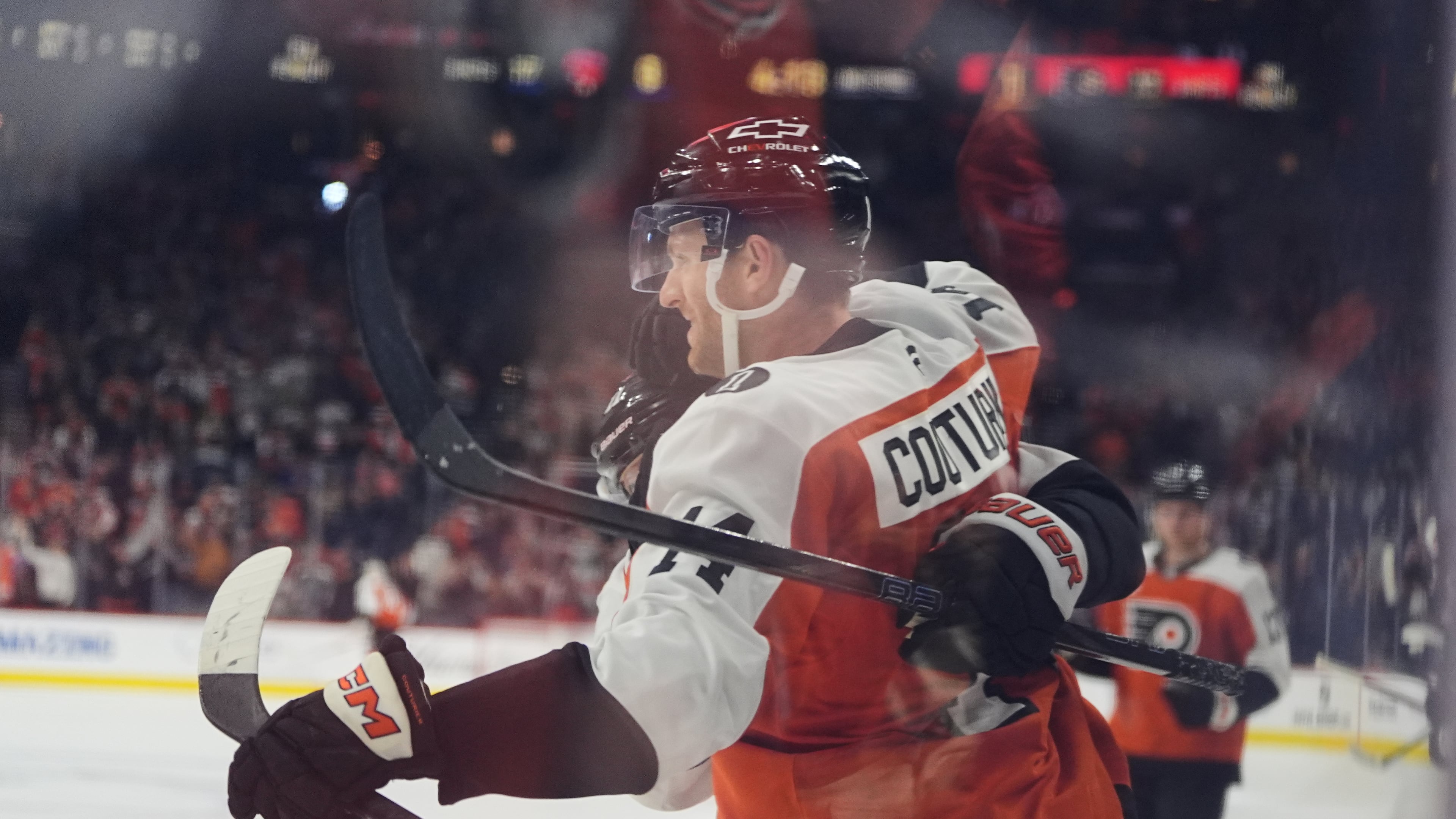 Philadelphia Flyers' Sean Couturier celebrates after scoring past Florida Panthers goaltender Daniil Tarasov during the second period of an NHL hockey game, Monday, Oct. 13, 2025, in Philadelphia. (AP Photo/Matt Rourke)