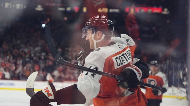 Philadelphia Flyers' Sean Couturier celebrates after scoring past Florida Panthers goaltender Daniil Tarasov during the second period of an NHL hockey game, Monday, Oct. 13, 2025, in Philadelphia. (AP Photo/Matt Rourke)
