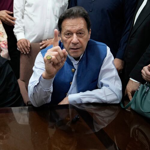 FILE - Pakistan's former Prime Minister Imran Khan, right, and Bushra Bibi, his wife, speak to the media before signing documents to submit surety bond over his bails in different cases, at an office of Lahore High Court in Lahore, Pakistan, on July 17, 2023. (AP Photo/K.M. Chaudary, File)