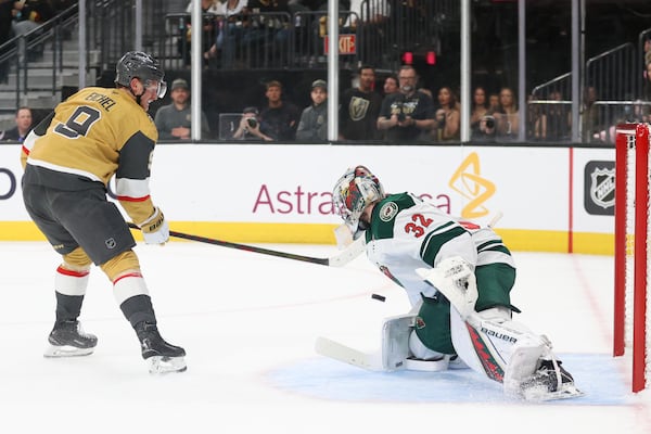 Minnesota Wild goaltender Filip Gustavsson (32) stops a shot from Vegas Golden Knights center Jack Eichel (9) during the second period in Game 1 of an NHL hockey Stanley Cup first-round playoff series Sunday, April 20, 2025, in Las Vegas. (AP Photo/Ian Maule)