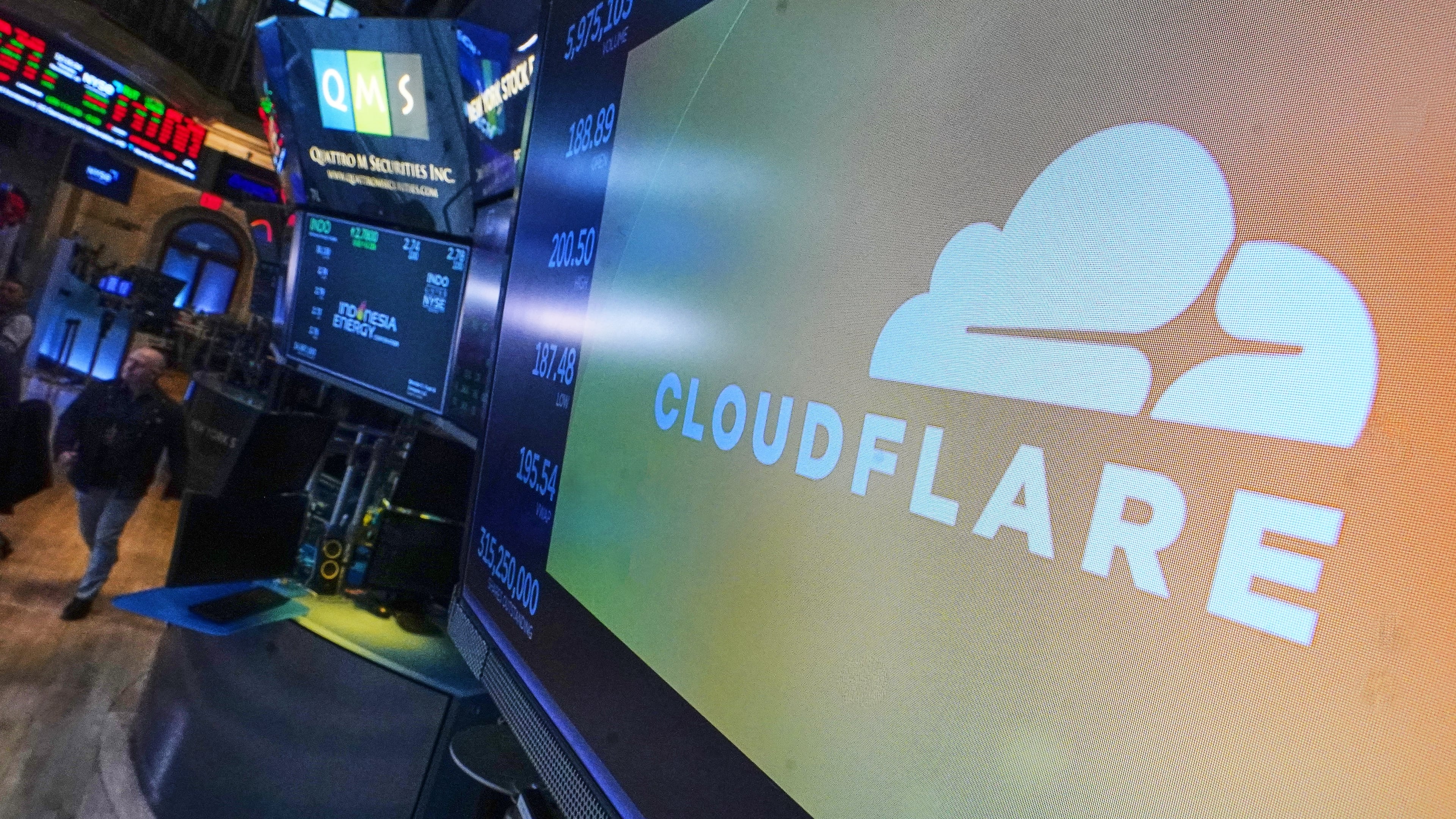 The logo for Cloudflare is displayed above a trading post on the floor of the New York Stock Exchange, Tuesday, Nov. 18, 2025. (AP Photo/Richard Drew)