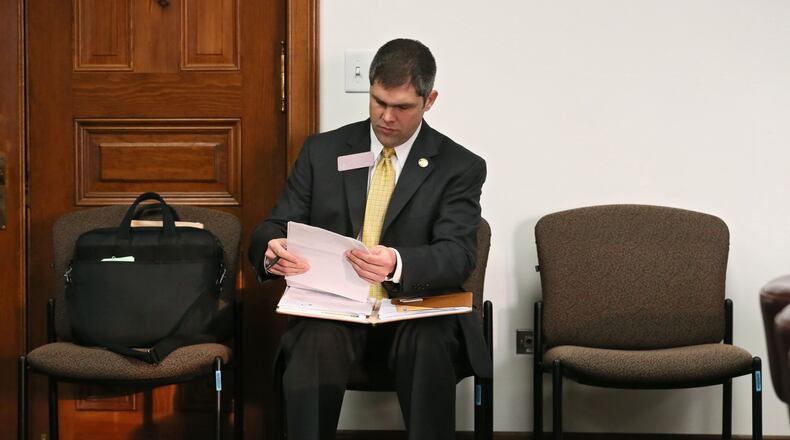 Mar. 16, 2016 - Atlanta - Rep. Shaw Blackmon, R - Bonaire, who carried the bill, prepares for the meeting. Two days after stalling an insurance agents minimum commission bill because a majority of the Senate Insurance Committee had a conflict of interest, the panel approved it Wednesday. The committee passed the bill pushed by House Rules Chairman John Meadows, an insurance agent. That, in turn, will likely break the logjam of Senate bills that have been waiting for Meadows to allow on the House floor in the final few days of the session. The panel stalled Meadows’ bill a day after the Atlanta Journal-Constitution raises questions about the legislation and its powerful author. BOB ANDRES / BANDRES@AJC.COM