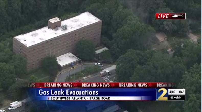 Residents of a southwest Atlanta high-rise building were evacuated Tuesday after construction crews damaged a nearby gas line, authorities said.