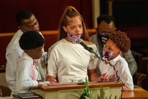 Charmaine Turner, mother of Secoriea Turner, is surrounded by her sons and Secoriea's father, Secoriey Williamson. 