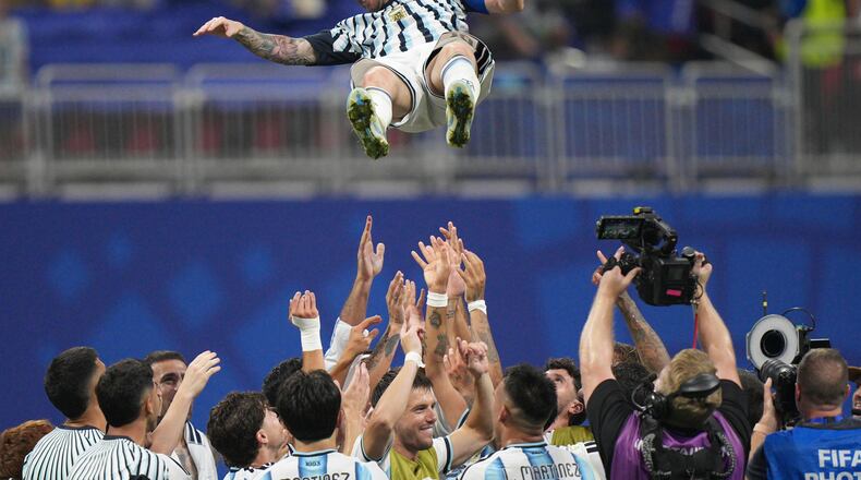 Argentina players toss teammate Lionel Messi (10) into the air as they celebrate after the World Cup round of 16 soccer match between Argentina and Egypt in Atlanta, Tuesday, July 7, 2026. (AP Photo/Jacob Kupferman)