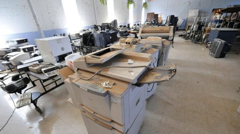Ruined items like this copier were placed in the school's lunchroom for inventory.