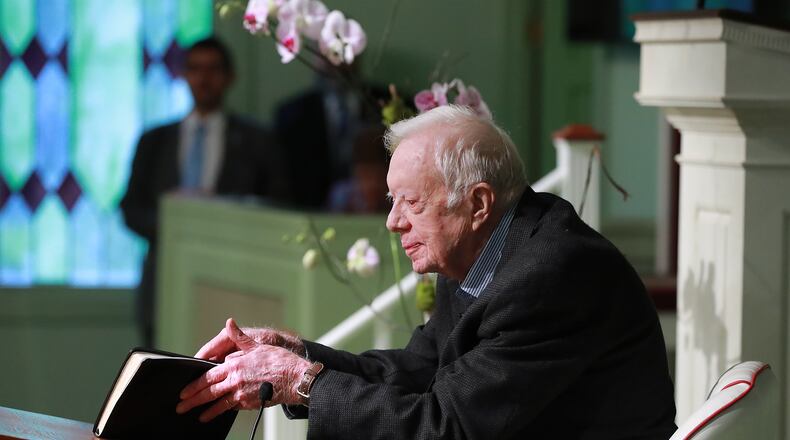 June 9, 2019 Plains: President Jimmy Carter, 94, the 39th U.S. president and Plains native, opens his Bible to begin the lesson as he returns to Maranatha Baptist Church to teach Sunday School less than a month after falling and breaking his hip on Sunday, June 9, 2019, in Plains.  Curtis Compton/ccompton@ajc.com