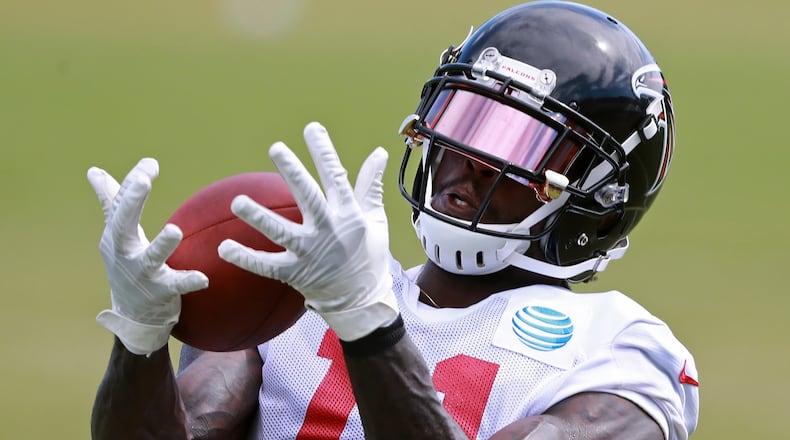 Atlanta Falcons wide receiver Julio Jones catches a pass during a NFL football training camp practice on Tuesday, August 7, 2018, in Flowery Branch. Curtis Compton/ccompton@ajc.com