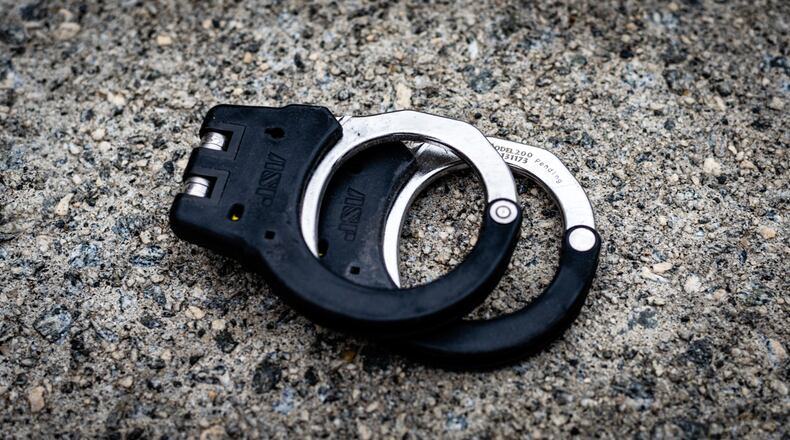 A father and son are being held at the Forsyth County Jail with no bond.