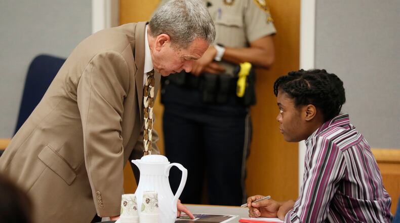 April 25, 2019 - Lawrenceville - Former District Attorney Danny Porter discusses exhibits that are being entered into evidence with Tiffany Moss.  File photo. Bob Andres / bandres@ajc.com
