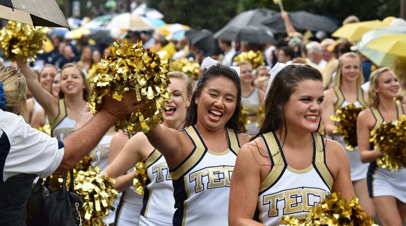 Georgia Tech cheerleaders lead the team to Bobby Dodd Stadium before the start of the Georgia Tech season opener against the Alcorn State Braves on Thursday, September 3, 2015. HYOSUB SHIN / HSHIN@AJC.COM