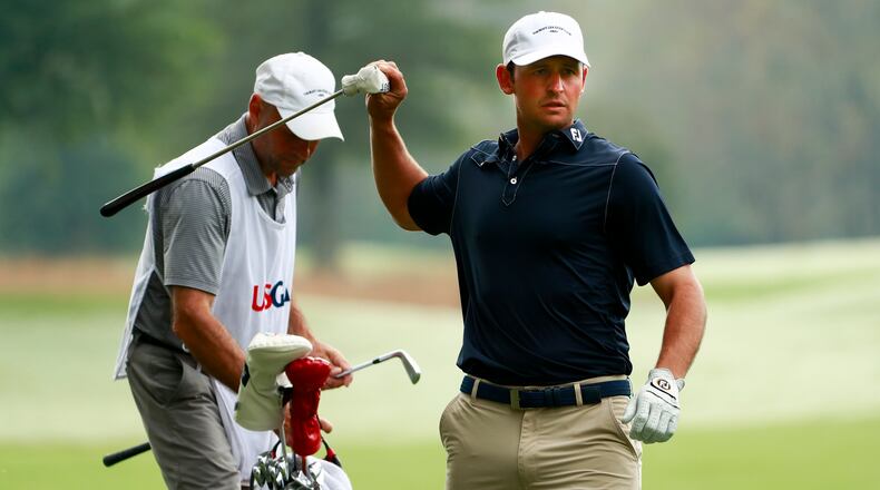 Matt Parziale pulling his putter out of his bag as he heads to the 18th hole during the quarterfinal round of match play at the 2017 U.S. Mid-Amateur at Capital City Club in Atlanta, Ga. on Thursday, Oct. 12, 2017. (Copyright USGA/Chris Keane)