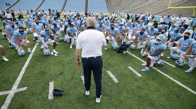 On September 12, 2020, North Carolina head coach Mack Brown meets with his team following a win against Syracuse at Kenan Stadium in Chapel Hill, North Carolina. Brown's Tar Heels were back in action on Saturday, Oct. 10, 2020, sweeping aside No. 19 Virginia Tech, 56-45. (Robert Willett/The Raleigh News & Observer/TNS)