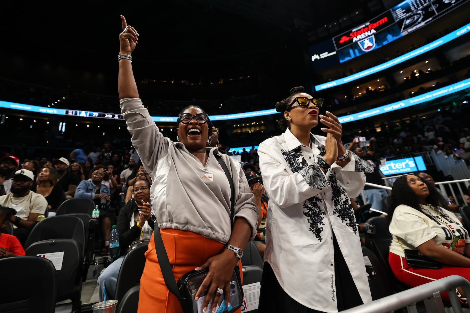 Fans react during the second half of a WNBA game between the Atlanta Dream and Las Vegas Aces at State Farm Arena on Sunday, May 17, 2026, in Atlanta. (Colin Hubbard for the AJC) 