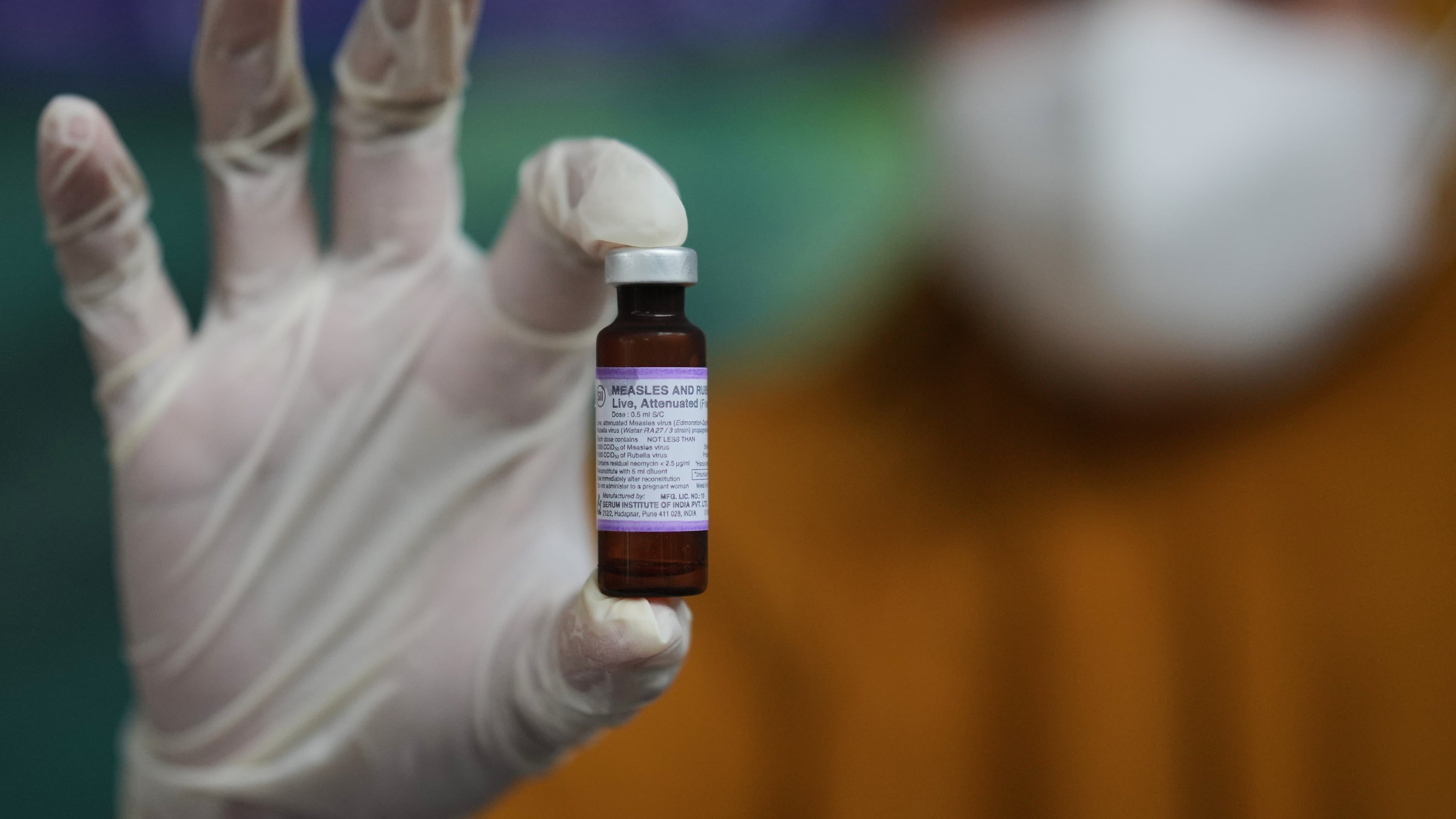 A health worker shows a vial of measles-rubella vaccine during a vaccination campaign in Sumenep on Madura Island, Indonesia, Monday, Sept. 8, 2025. (AP Photo/Dita Alangkara)