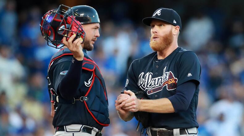 Braves starting pitcher Mike Foltynewicz talks with catcher Tyler Flowers after loading the bases in the first inning against the Los Angeles Dodgers during Game One of the NLDS Thursday, October 4, 2018, in Los Angeles, Ca. Curtis Compton/ccompton@ajc.com