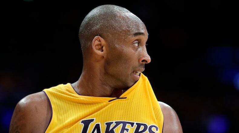 Los Angeles Lakers forward Kobe Bryant watches during the second half of an NBA basketball game against the Houston Rockets in Los Angeles, Thursday, Dec. 17, 2015. (AP Photo/Chris Carlson)