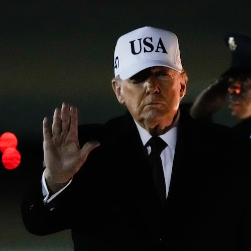 President Donald Trump waves after arriving on Air Force One from Florida, Sunday, Jan. 11, 2026, at Joint Base Andrews, Md. (AP Photo/Julia Demaree Nikhinson)