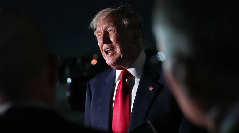 President Donald Trump speaks to reporters before he boards Air Force One at Dallas Fort Worth International Airport, Thursday, Sept. 10, 2026, in Dallas. (AP Photo/Julia Demaree Nikhinson)
