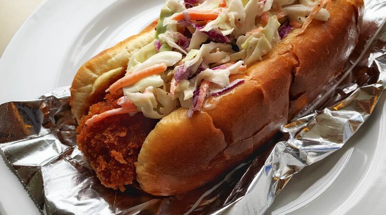 The hot dog from Ponko Chicken is fried, with a Japanese-influenced breading similar to the restaurant's famous chicken. Henri Hollis/henri.hollis@ajc.com