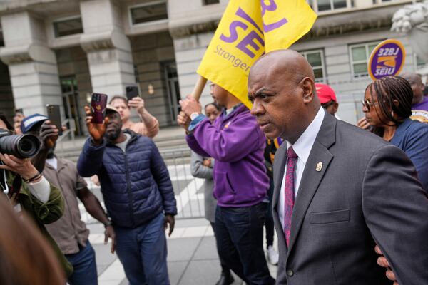 Mayor Ras Baraka, right, arrives to speak to supporters and media after a court appearance in Newark, N.J., Thursday, May 15, 2025. (AP Photo/Seth Wenig)