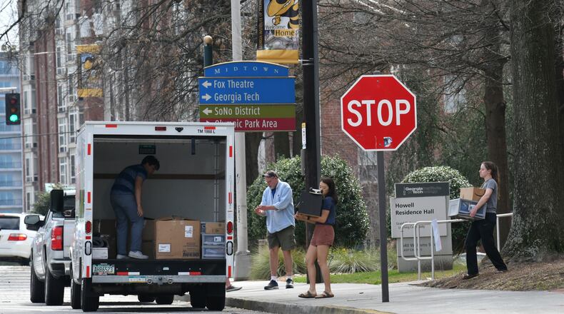 Georgia Tech students load a truck on  campus on Saturday, March 14, 2020.  The campus was closed to students after the coronavirus outbreak became a crisis in the United States.