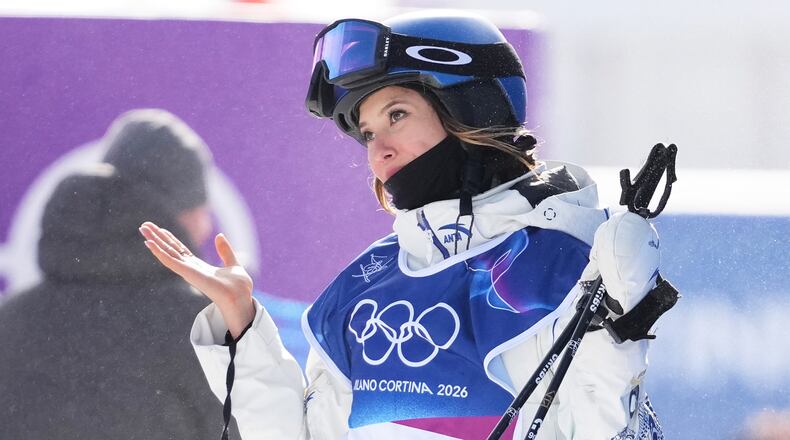 China's Eileen Gu reacts after crashing during the women's freestyle skiing slopestyle finals at the 2026 Winter Olympics, in Livigno, Italy, Monday, Feb. 9, 2026. (AP Photo/Lindsey Wasson)