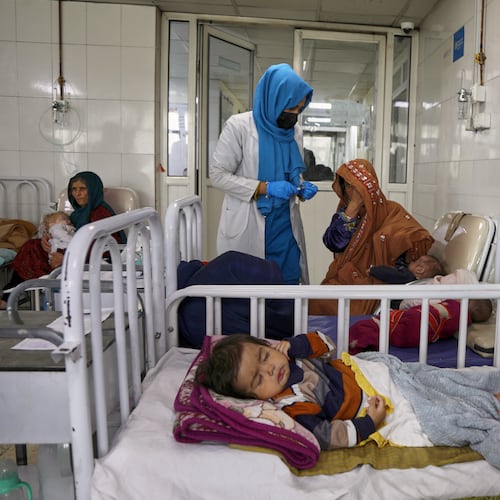 FILE - Afghan women care for their children in the malnutrition ward at Indira Gandhi Children's Hospital in Kabul, Afghanistan, Feb. 15, 2026. (AP Photo/Siddiqullah Alizai, File)