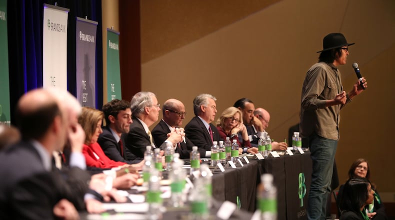 Independent candidate Alexander Hernandez makes the move to be the first of 18 hopefuls in Georgia’s 6th Congressional District to speak to the crowd at a forum Wednesday at the Cobb Energy Performing Arts Centre in Marietta. The special election is set for April 18. (HENRY TAYLOR / HENRY.TAYLOR@AJC.COM)
