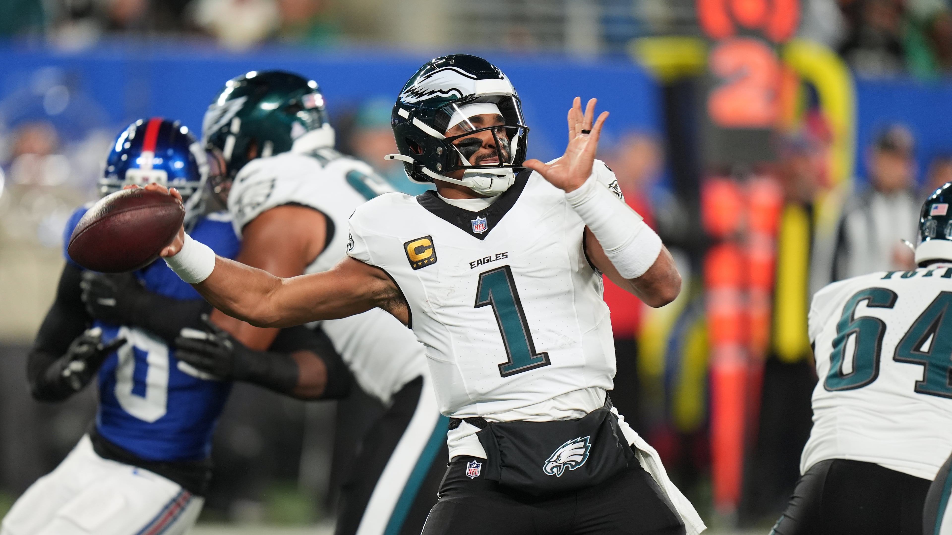 Philadelphia Eagles' Jalen Hurts plays during the first half of an NFL football game against the New York Giants Thursday, Oct. 9, 2025, in East Rutherford, N.J. (AP Photo/Seth Wenig)