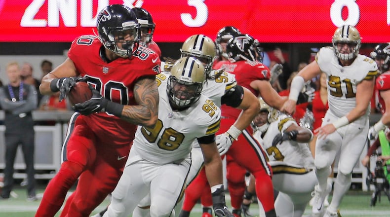 12/7/17 - Atlanta - Atlanta Falcons tight end Levine Toilolo (80) extends a catch near the end of the second quarter that lead to a Falcons TD. Atlanta Falcons play their rival, the New Orleans Saints in an NFL football game at Mercedes-Benz Stadium in Atlanta. BOB ANDRES /BANDRES@AJC.COM