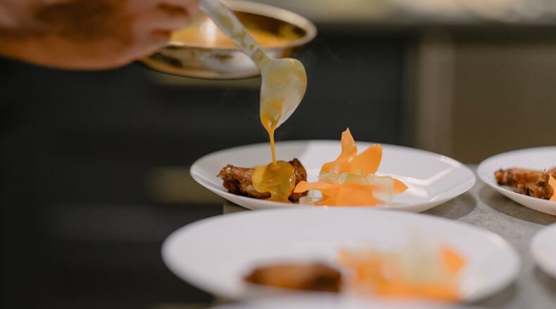 Chef Demetrius Brown will open his Heritage Supper Club as a brick-and-mortar in Summerhill next year. The supper club offers this lemon pepper wings and crudite, plus other dishes. (Courtesy of James Ly)