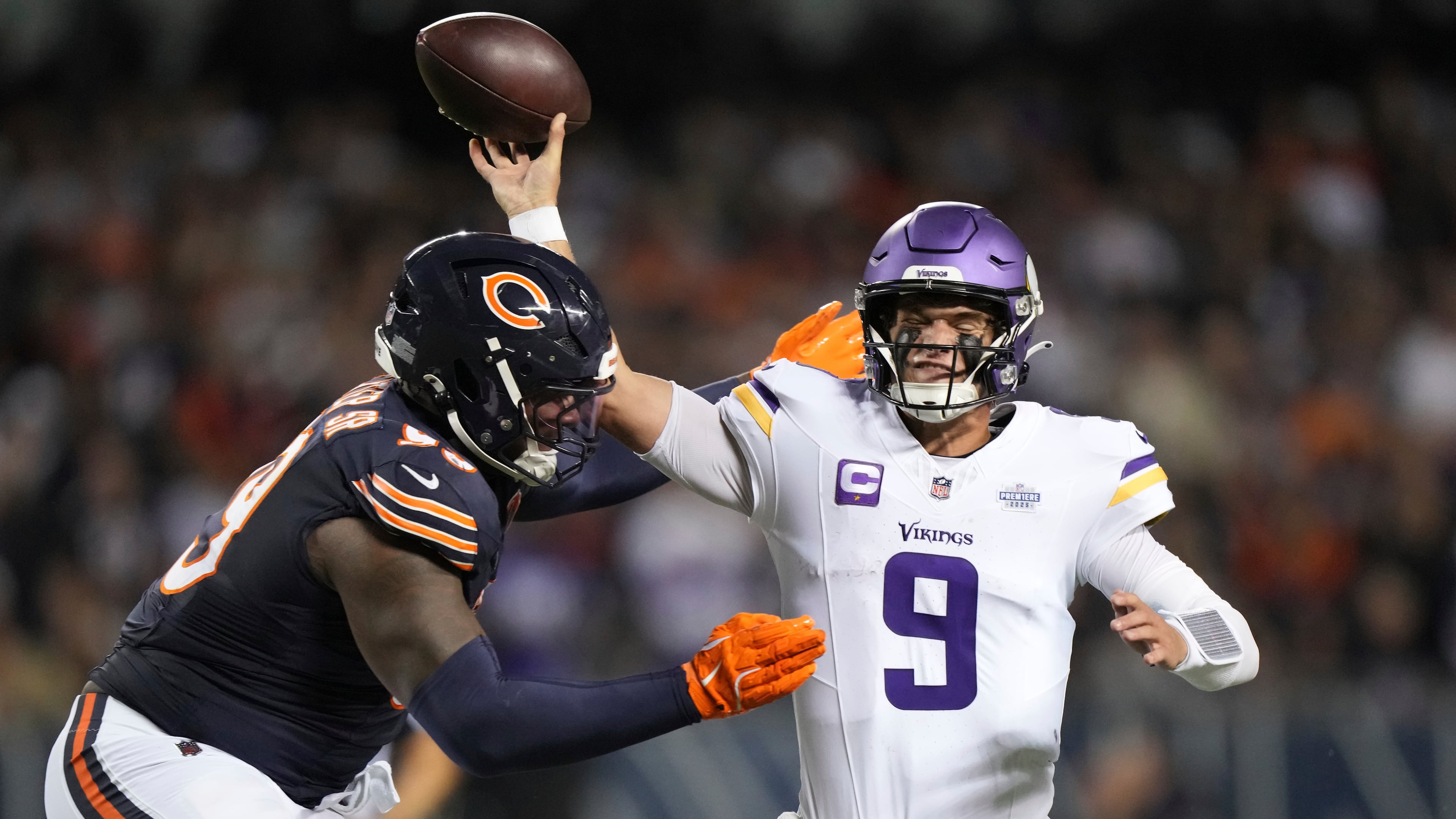Minnesota Vikings quarterback J.J. McCarthy (9) throws under pressure from Chicago Bears defensive lineman Gervon Dexter Sr. during the second half of an NFL football game Monday, Sept. 8, 2025, in Chicago. (AP Photo/Nam Y. Huh)