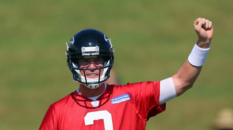 Falcons quarterback Matt Ryan calls a play on the first day of practice at training camp on Thursday, July 25, 2013, in Flowery Branch. CURTIS COMPTON / CCOMPTON@AJC.COM