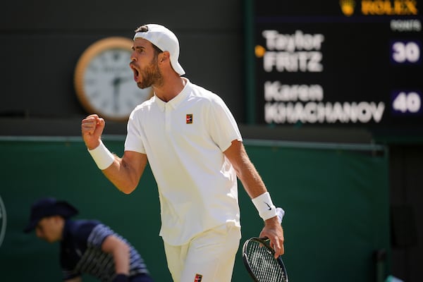 Karen Khachanov of Russia reacts during the men's singles quarter final match against Taylor Fritz of the U.S. at the Wimbledon Tennis Championships in London, Tuesday, July 8, 2025.(AP Photo/Kin Cheung)