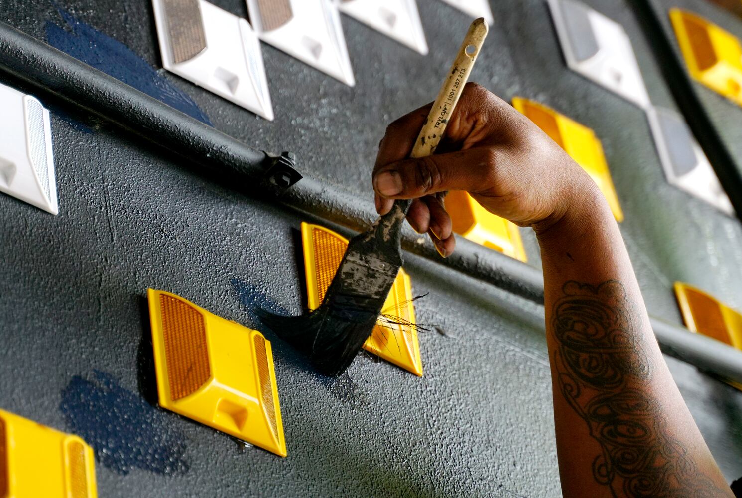 Painters work in an underpass