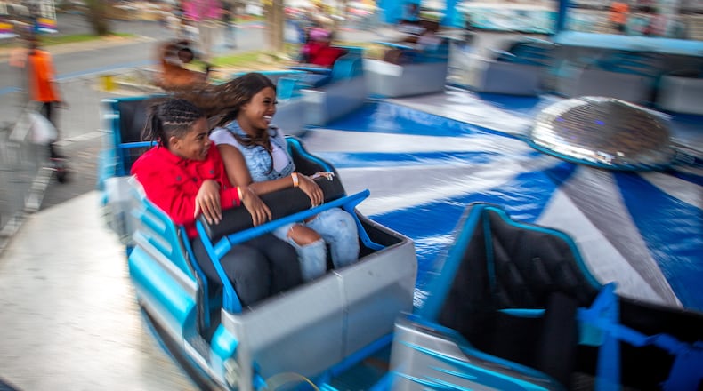 People enjoy the rides at the Atlanta Fair on Sunday, March 6, 2022. This was the opening weekend for the annual fair that runs through April 10. (Photo by Steve Schaefer for The Atlanta Journal-Constitution)