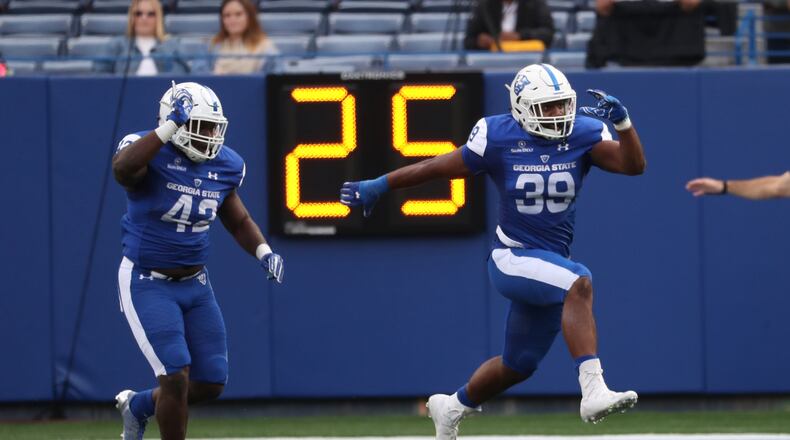 November 25, 2017 - Atlanta, Ga: Georgia State Panthers linebacker Trey Payne (42) and linebacker Chase Middleton (39) celebrate a goal line stand in the second quarter against Appalachian State at GSU Stadium Saturday, November 25, 2017, in Atlanta. PHOTO / JASON GETZ