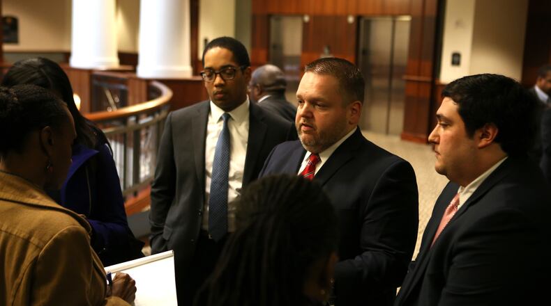 District Attorney Brian Fortner (center) outside a Douglas County courtroom in 2017. HENRY TAYLOR / HENRY.TAYLOR@AJC.COM