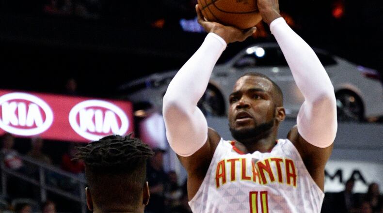 Atlanta Hawks forward Paul Millsap (4) shoots as Philadelphia 76ers forward Nerlens Noel (4) defends during the first half of an NBA basketball game, Saturday, Jan. 21, 2017, in Atlanta. (AP Photo/John Amis)