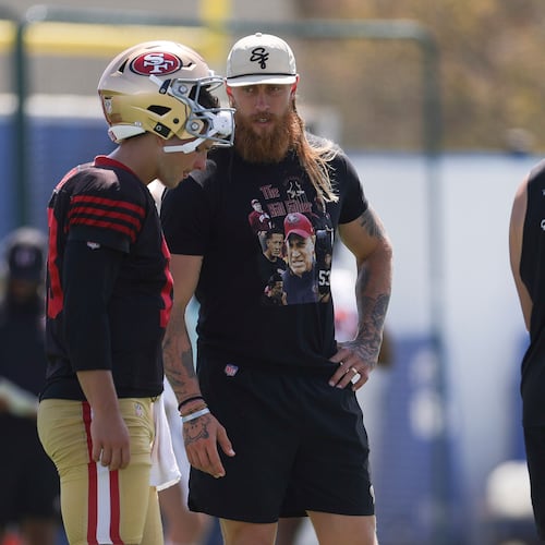San Francisco 49ers quarterback Brock Purdy (13) talks with tight end George Kittle during a joint NFL football practice with the Los Angeles Chargers, Tuesday, Aug. 18, 2026, in El Segundo, Calif. (AP Photo/Ryan Sun)
