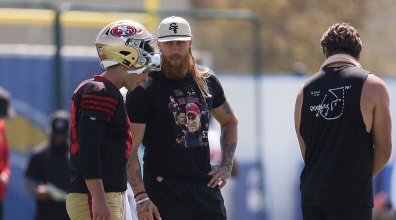 San Francisco 49ers quarterback Brock Purdy (13) talks with tight end George Kittle during a joint NFL football practice with the Los Angeles Chargers, Tuesday, Aug. 18, 2026, in El Segundo, Calif. (AP Photo/Ryan Sun)