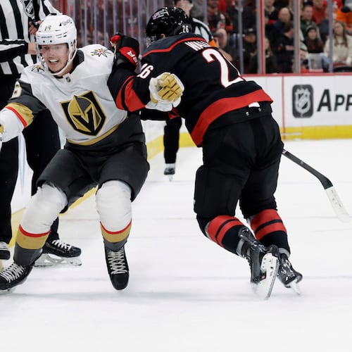 FILE - Vegas Golden Knights right wing Pavel Dorofeyev (16) and Carolina Hurricanes defenseman Sean Walker (26) vie for the puck during the first period of an NHL hockey game Oct. 28, 2025, in Raleigh, N.C. (AP Photo/Chris Seward, File)