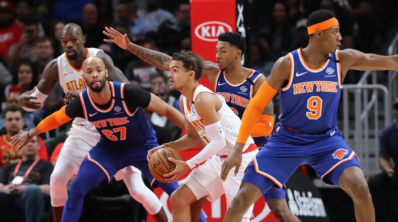 Hawks' Trae Young looks to pass during overtime in a 136-131 loss to the New York Knicks in a NBA basketball game on Wednesday, March 11, 2020, in Atlanta. Curtis Compton ccompton@ajc.com