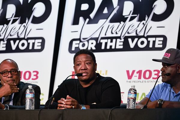 (Left to right) Radio personalities Frank Ski, Yung Joc and Gregg Street sit on a panel at the Black Radio Town Hall at Clark Atlanta University. (Natrice Miller/AJC 2022)  