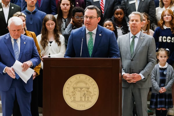 The Wall Street Journal editorial board blasted the tax plan of Lt. Burt Jones (podium), who is flanked by House Speaker Jon Burns (left) and Gov. Brian Kemp. (Abbey Cutrer/AJC))