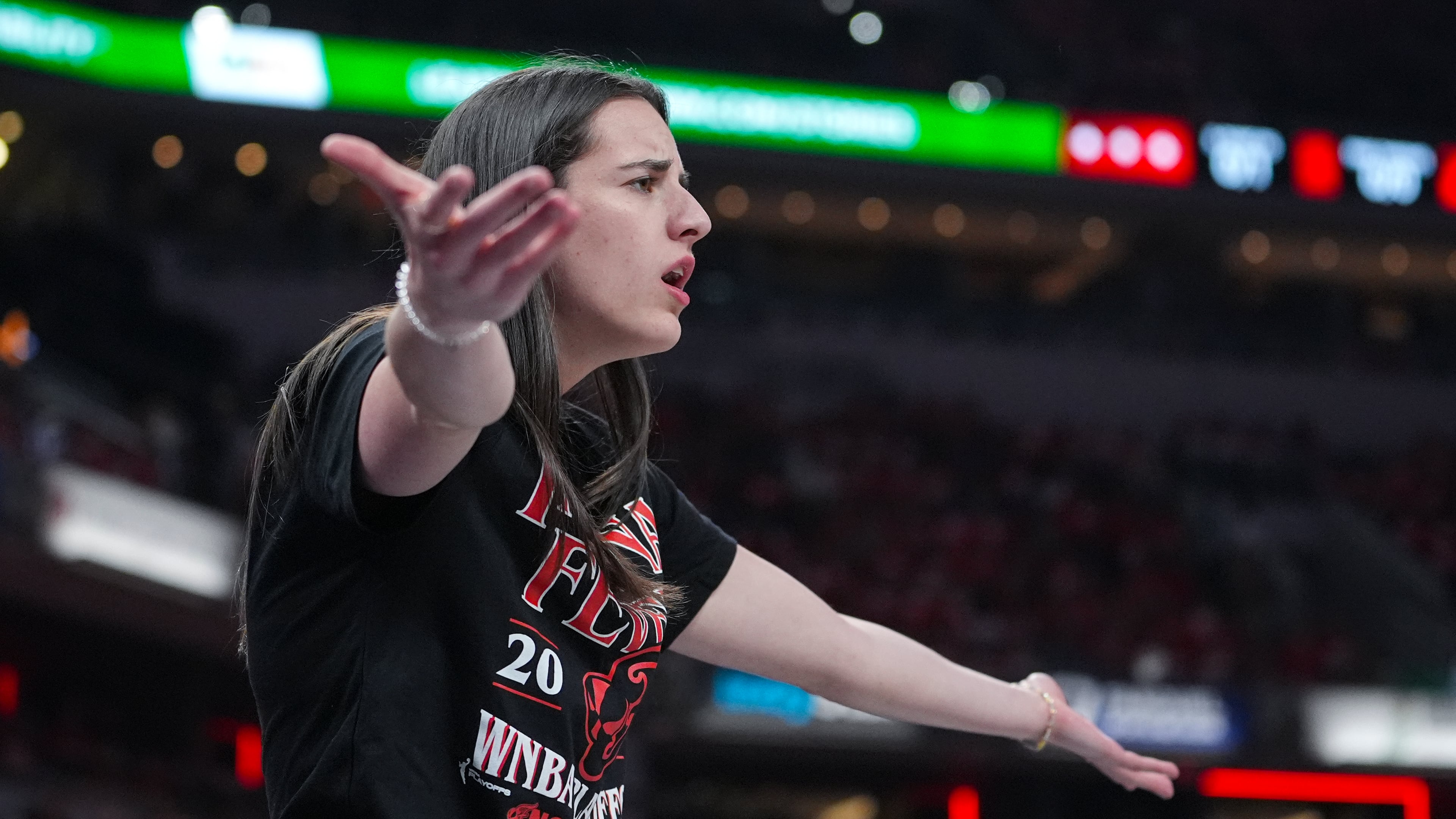 Indiana Fever guard Caitlin Clark (22) gestures on the bench in the first half of a WNBA basketball playoff game between the Indiana Fever and the Atlanta Dream in Indianapolis, Tuesday, Sept. 16, 2025. (AP Photo/Michael Conroy)