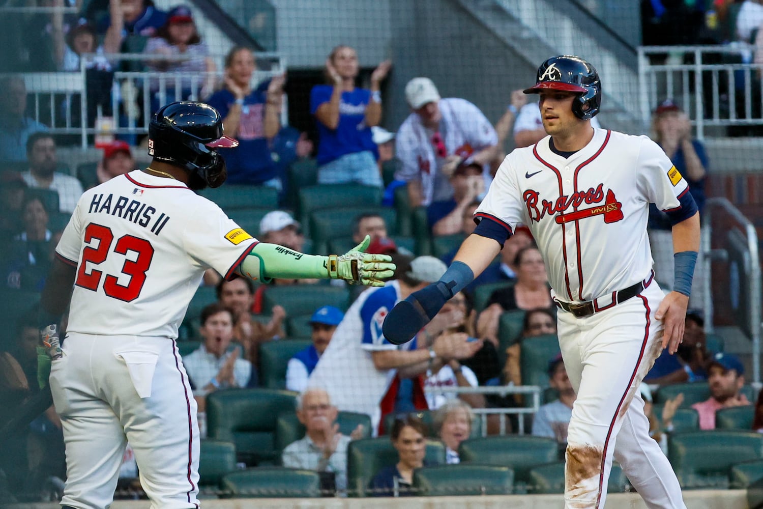 Atlanta Braves third base Austin Riley (27) is congratulated by Atlanta Braves outfielder Michael Harris II (23) after scoring the teeam’s first run during the third inning against the Washington Nationals on Monday, May 12, 2025, in Atlanta.  
(Miguel Martinez/ AJC)