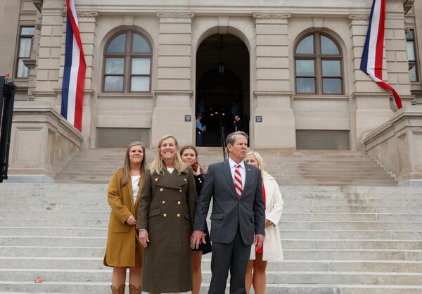 Gov. Brian Kemp, shown with his family following his inauguration earlier this month, has proposed income and property tax rebates, pay raises for teachers, increased school funding, worker training in the electric-vehicle industry and health insurance programs through his proposed state budget. (Natrice Miller/natrice.miller@ajc.com) 